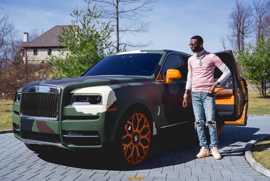 Young Dolph's signature camo wrap featuring a dolphin and crown on his Dodge Demon SRT