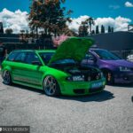 Signal Green Audi RS4 B5 at Wörthersee 2019, front quarter view, showcasing its aggressive stance and Rotiform wheels