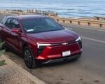 Side profile of the 2024 Chevy Blazer EV in Radiant Red, showcasing its design and color