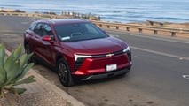 Side profile of the 2024 Chevy Blazer EV in Radiant Red, showcasing its design and color