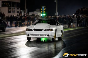 White Mustang race car in the pit area at No Mercy X, showcasing Tin Soldier Race Cars' Limited 235 build.