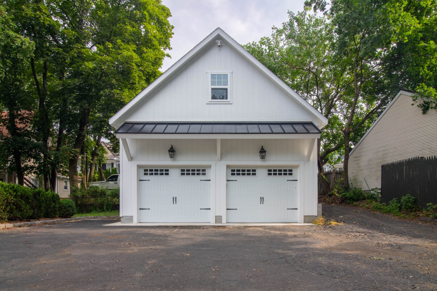 White 24x20 attic workshop 2-car garage with wood siding and rear hip roof in Greenwich, CT, highlighting attic storage within a smaller footprint