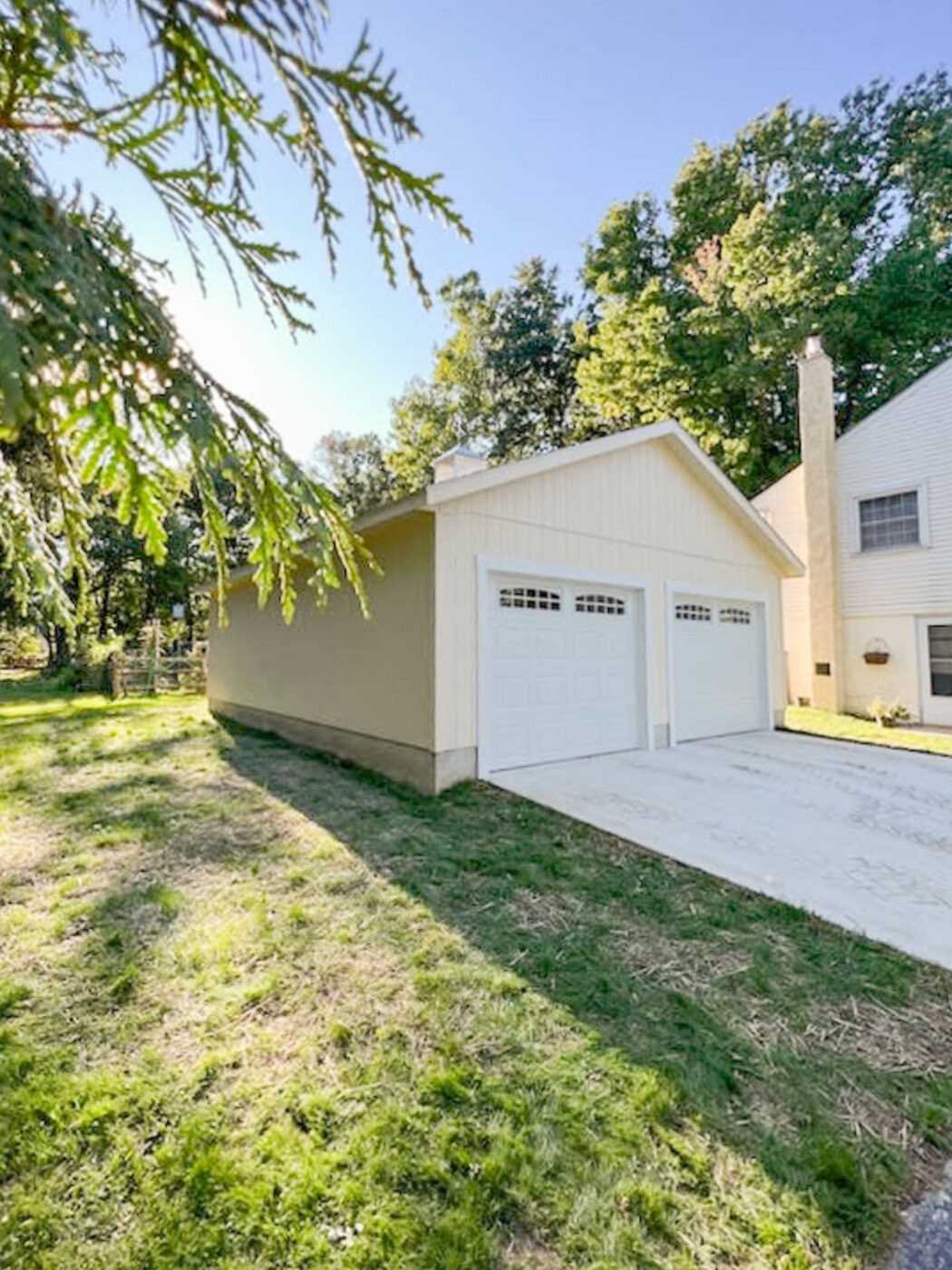 Navajo white 24x30 workshop 2-car garage in Malvern, PA, demonstrating ample depth for storage and workspace