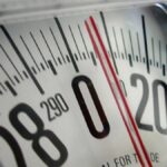 Woman Measuring Waist with Scale