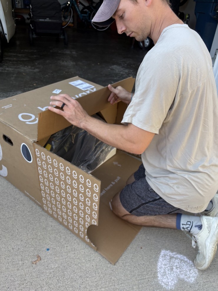 Dana Abraham receiving assistance with babyark car seat setup