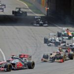 Formula 1 cars racing at the 2012 Canadian Grand Prix, featuring Jenson Button, Kimi Räikkönen, and Sergio Pérez among other drivers, highlighting the excitement of Formula 1 racing events.