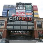 Citi Field stadium across from a line of auto body shops in Willets Point, Queens, NYC