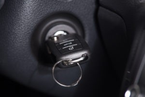 Car key firmly lodged in the ignition cylinder, a common vehicle problem requiring careful troubleshooting.