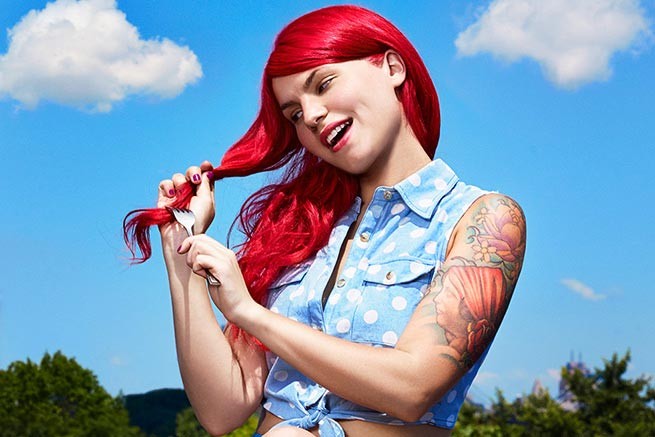 Carly Aquilino headshot promoting her stand-up shows at Comedy Works Denver