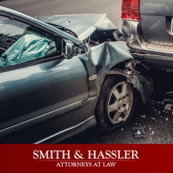 The front of a heavily damaged car after a head-on collision