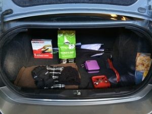 Car kit items laid out for winter preparedness