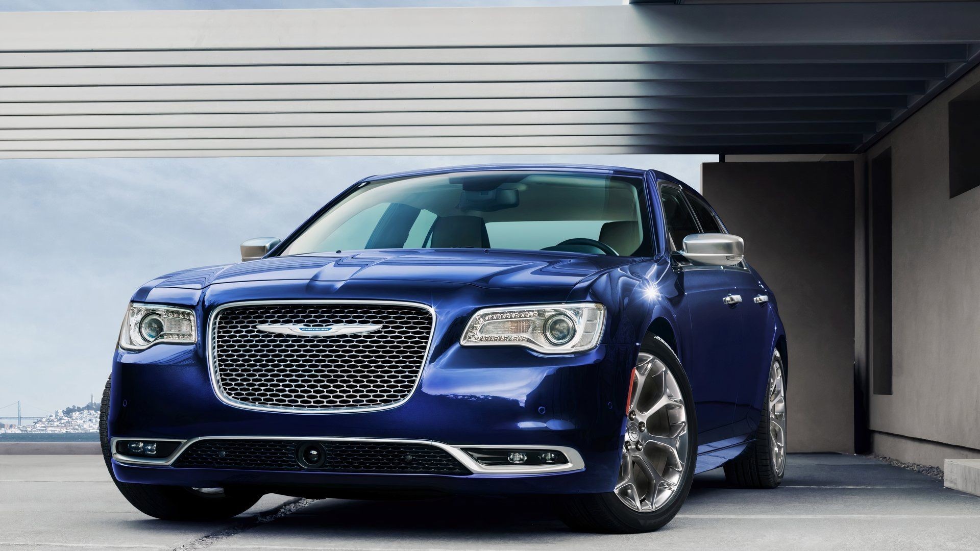 2020 Chrysler 300C in blue posing in front of modern home