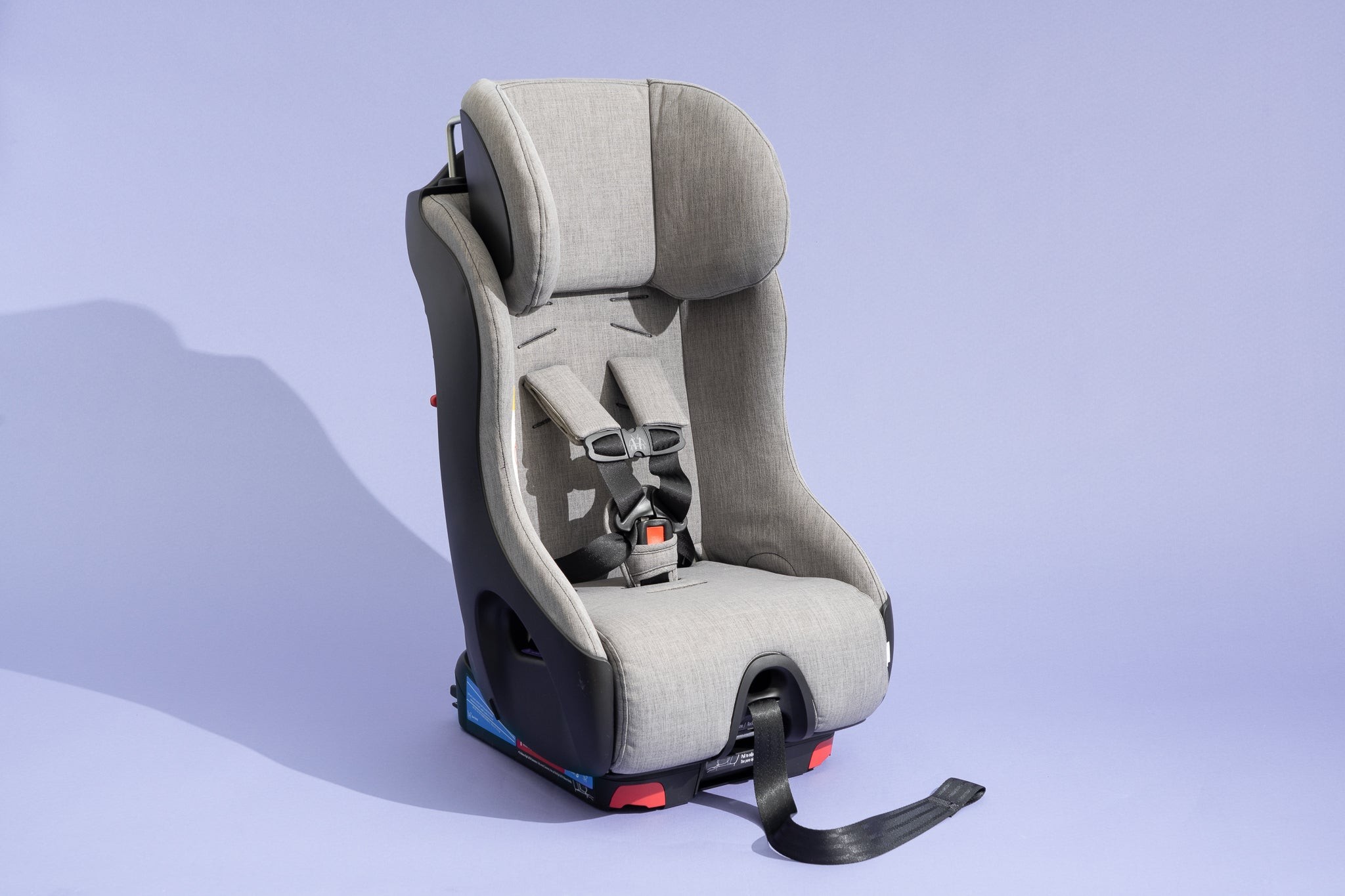 The Clek Foonf convertible car seat in a vehicle, showcasing its safe and comfortable design.