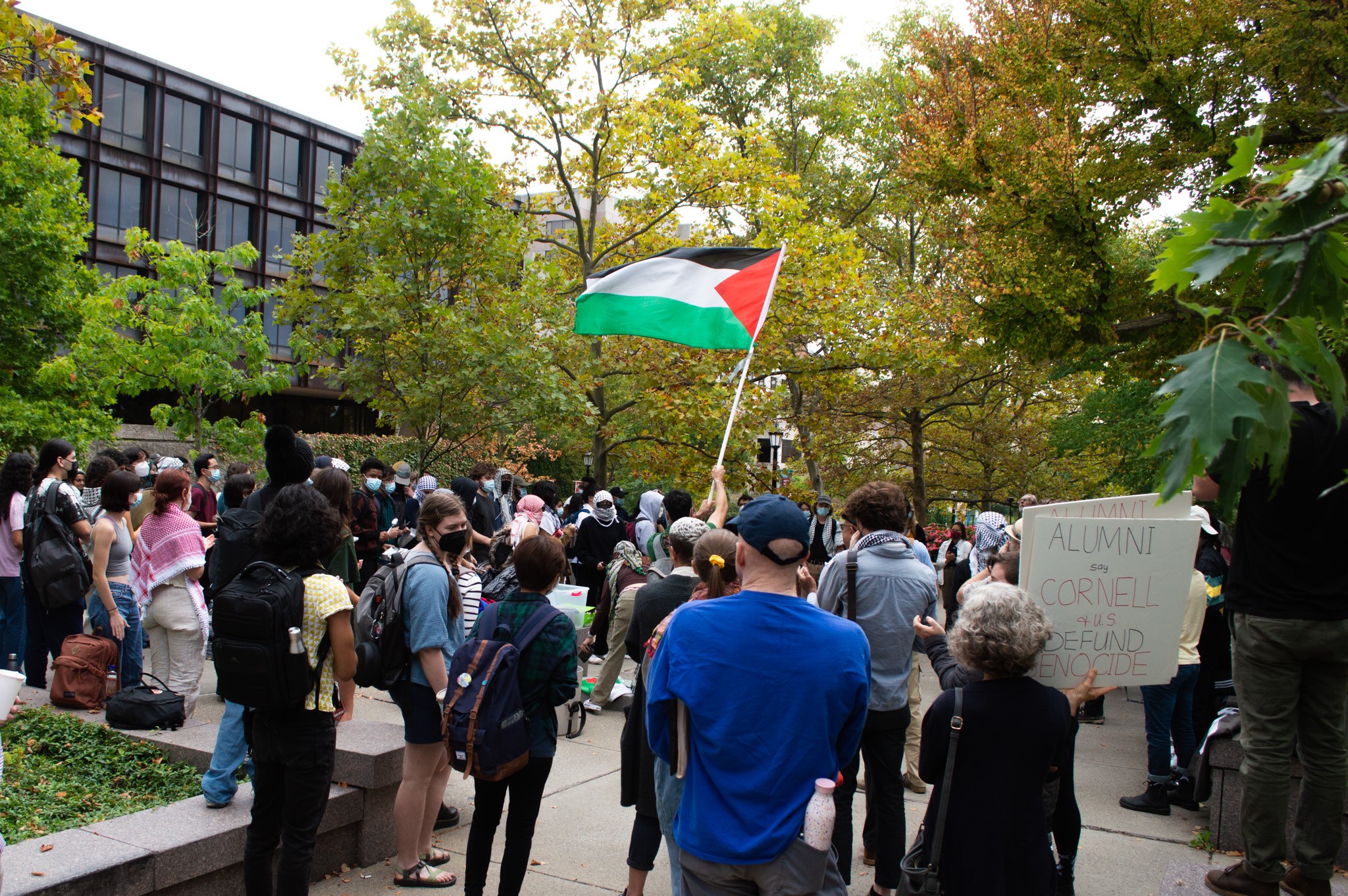 Protesters wave a Palestinian flag outside Day Hall.