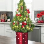 Cyclamen Christmas Gift Idea with Red Ribbon and Festive Decor