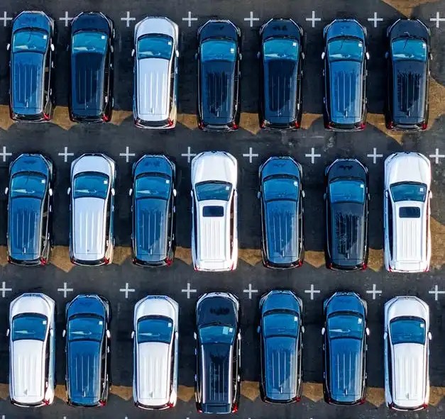 Overhead photo of a fleet of service vans.