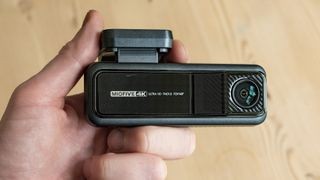 Miofive Dual Dash Cam front camera in hand