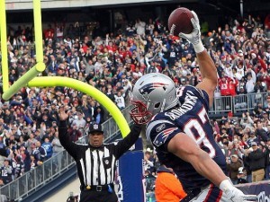 Rob Gronkowski with the New England Patriots, highlighting his impactful career stats and dominance on the field.