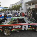 Historic race cars displayed on Alvarado Street in Monterey for Monterey Car Week Kickoff