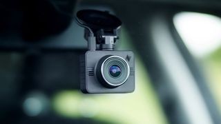 A car dash camera inside a car windscreen