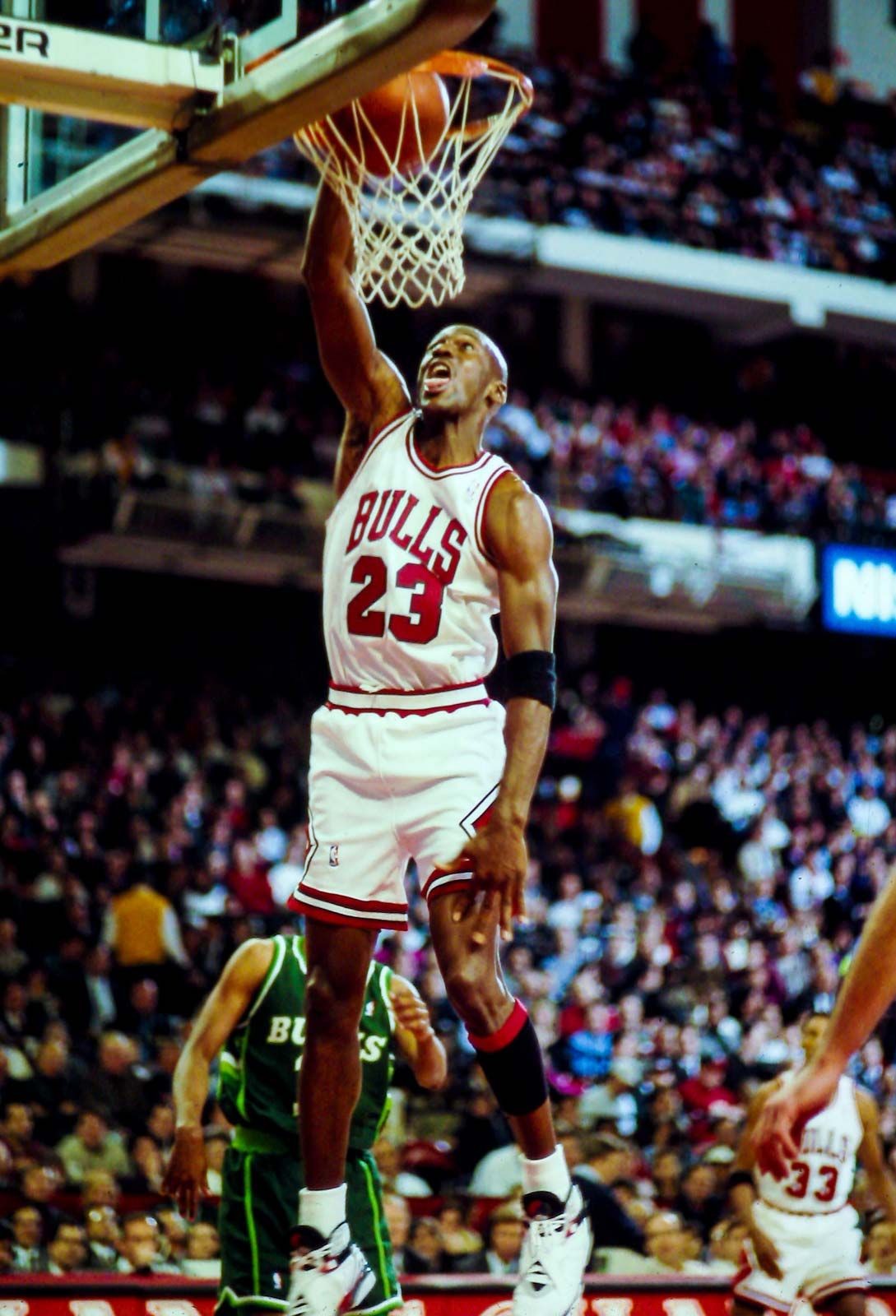 Michael Jordan in his early NBA career, showcasing his athleticism and scoring ability.