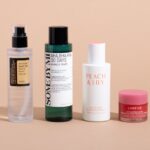 A curated selection of best Korean skin care products featuring snail mucin essence, glass skin serum, exfoliating toner, and lip sleeping mask.