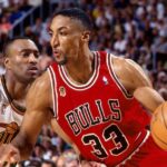 Scottie Pippen in his Chicago Bulls jersey showcasing his defensive prowess.