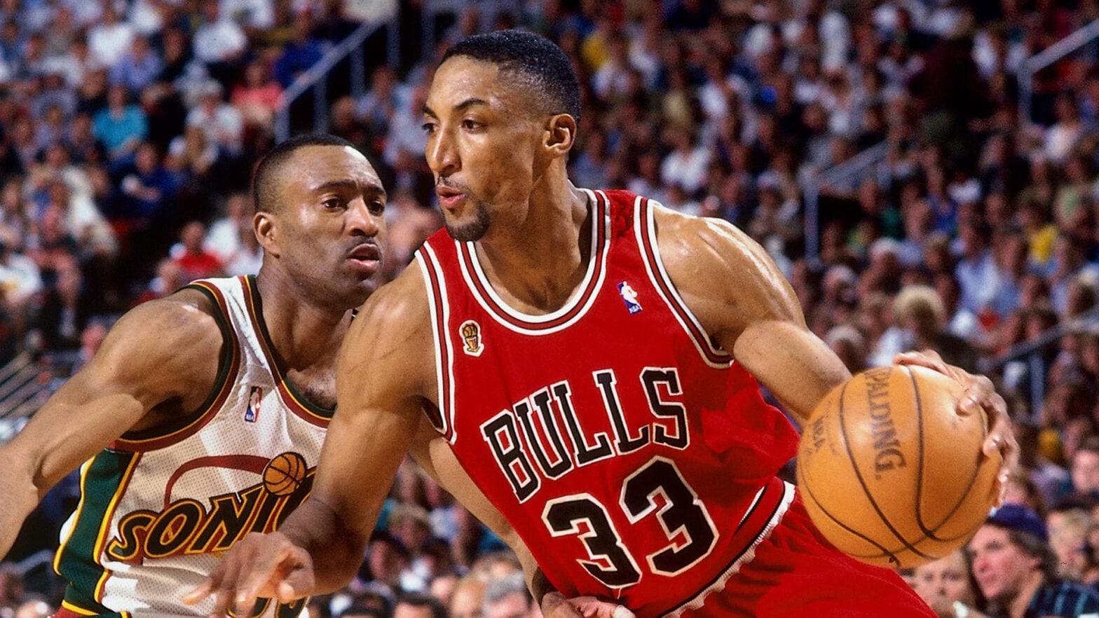 Scottie Pippen in his Chicago Bulls jersey showcasing his defensive prowess.