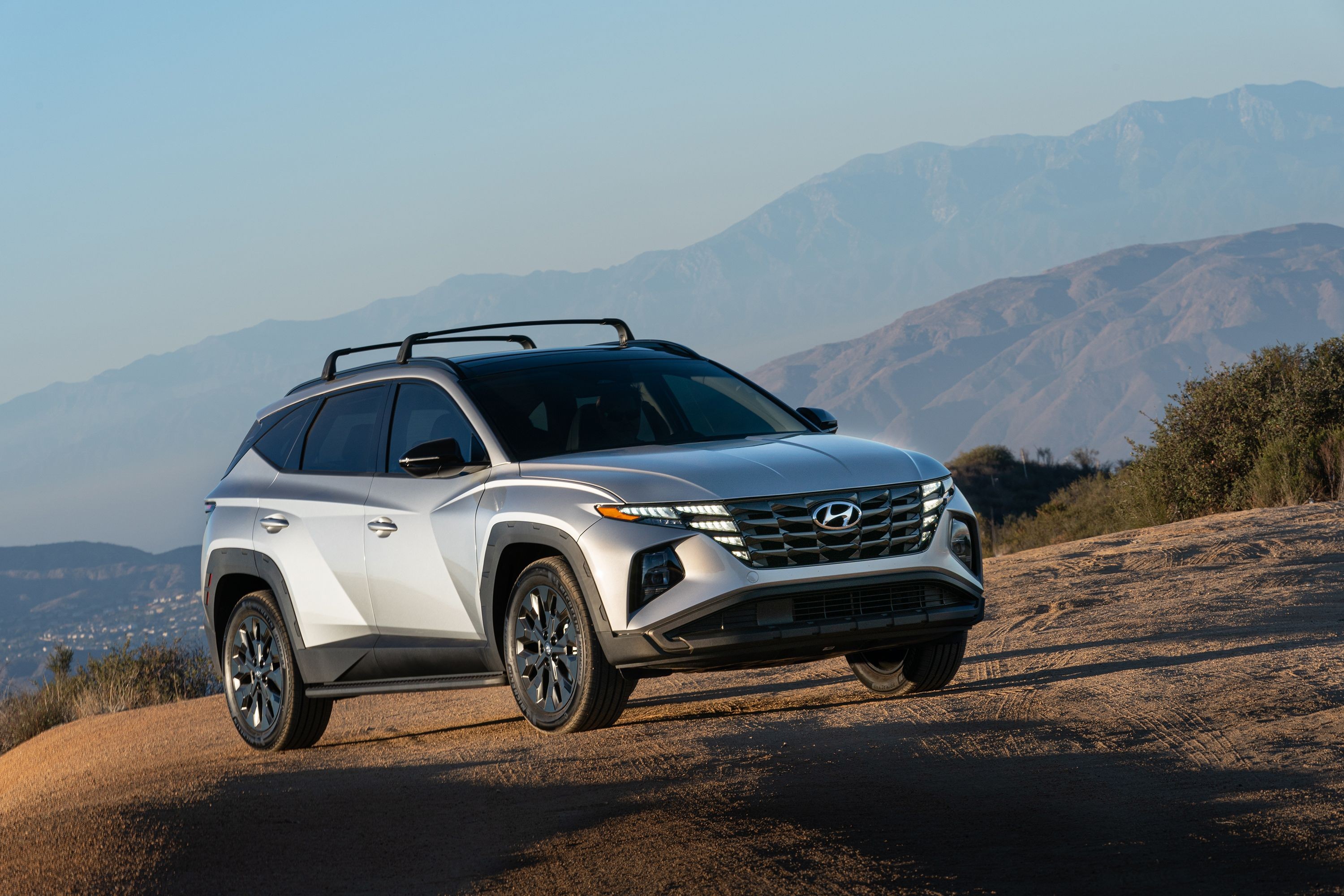 2022 Hyundai Tucson Hybrid SUV driving on a scenic road