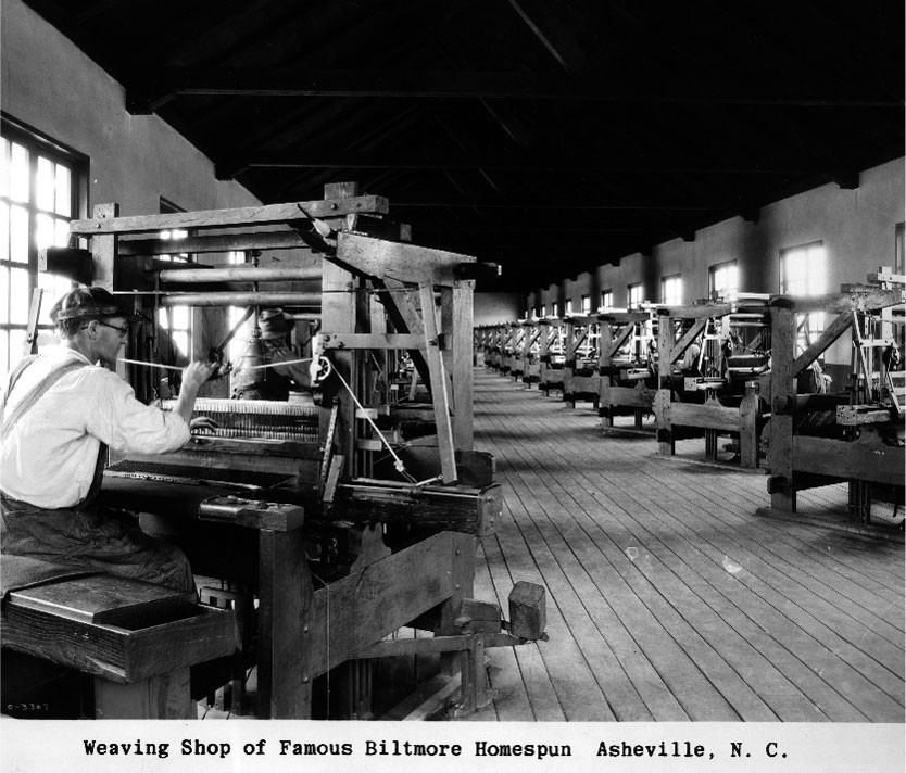 alt text: Interior view of the weaving shop at Biltmore Industries, the building now housing the antique car museum